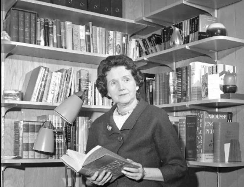  Rachel Carson  holds her book Silent Spring in the library of her Silver  Spring, Md., home...