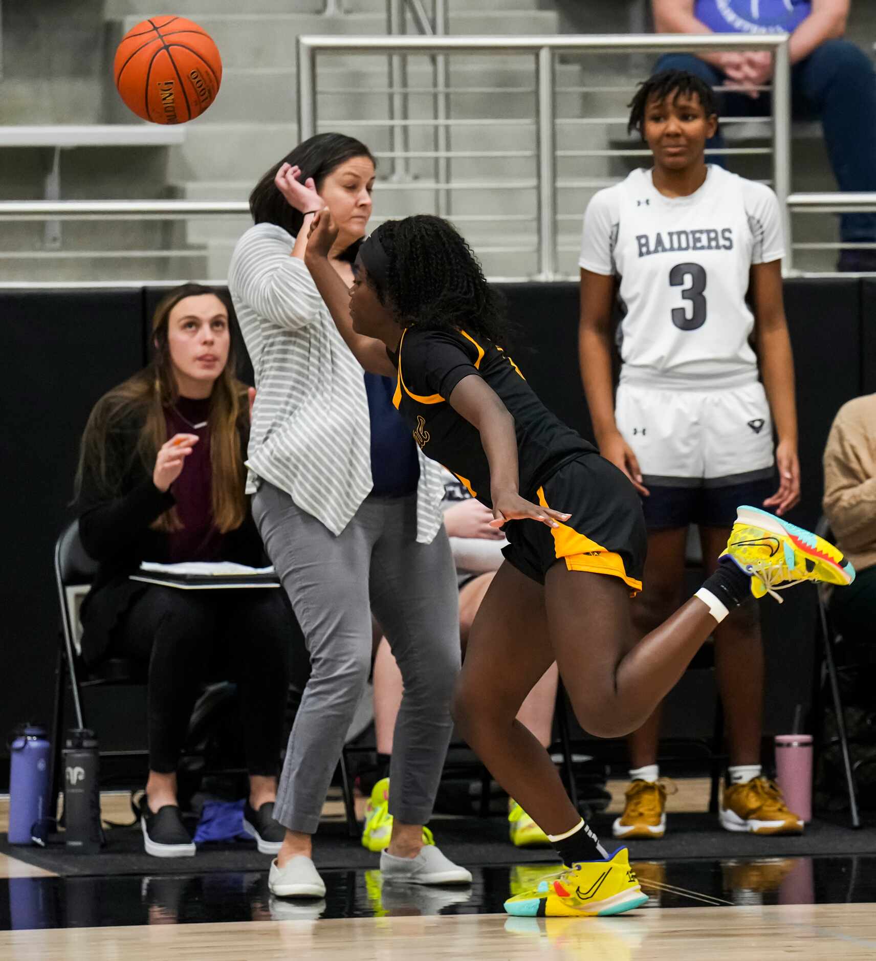 Frisco Memorial's Jasmyn Lott (10) tries to save the ball from going out of bounds while...