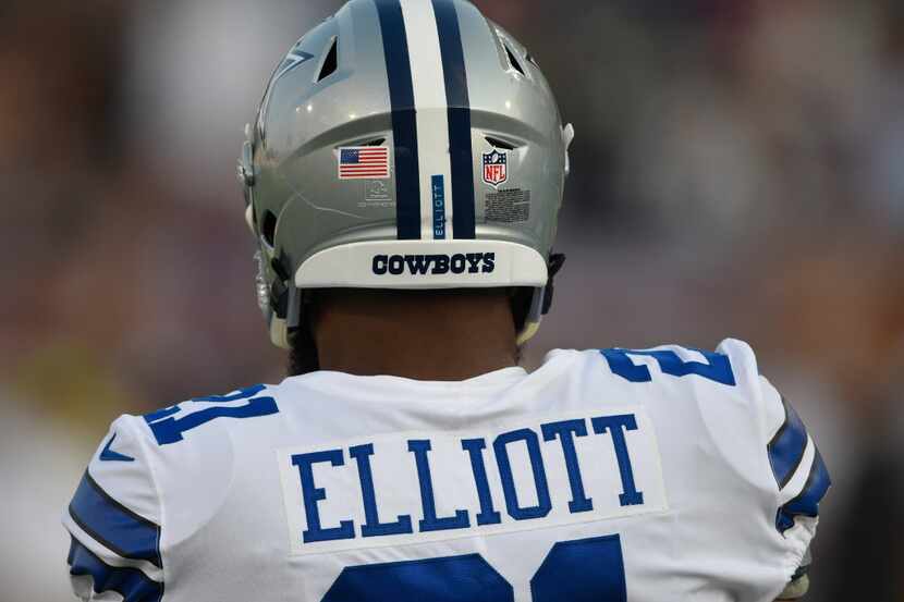 Dallas Cowboys running back Ezekiel Elliott walks on the field prior to the Pro Football...