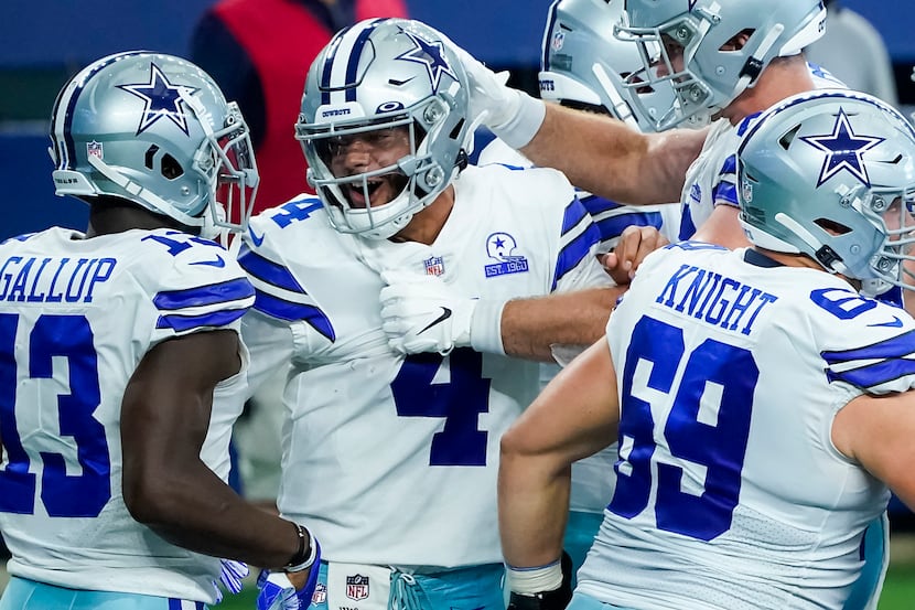 FILE - Cowboys quarterback Dak Prescott (4) celebrates after catching a touchdown pass from...