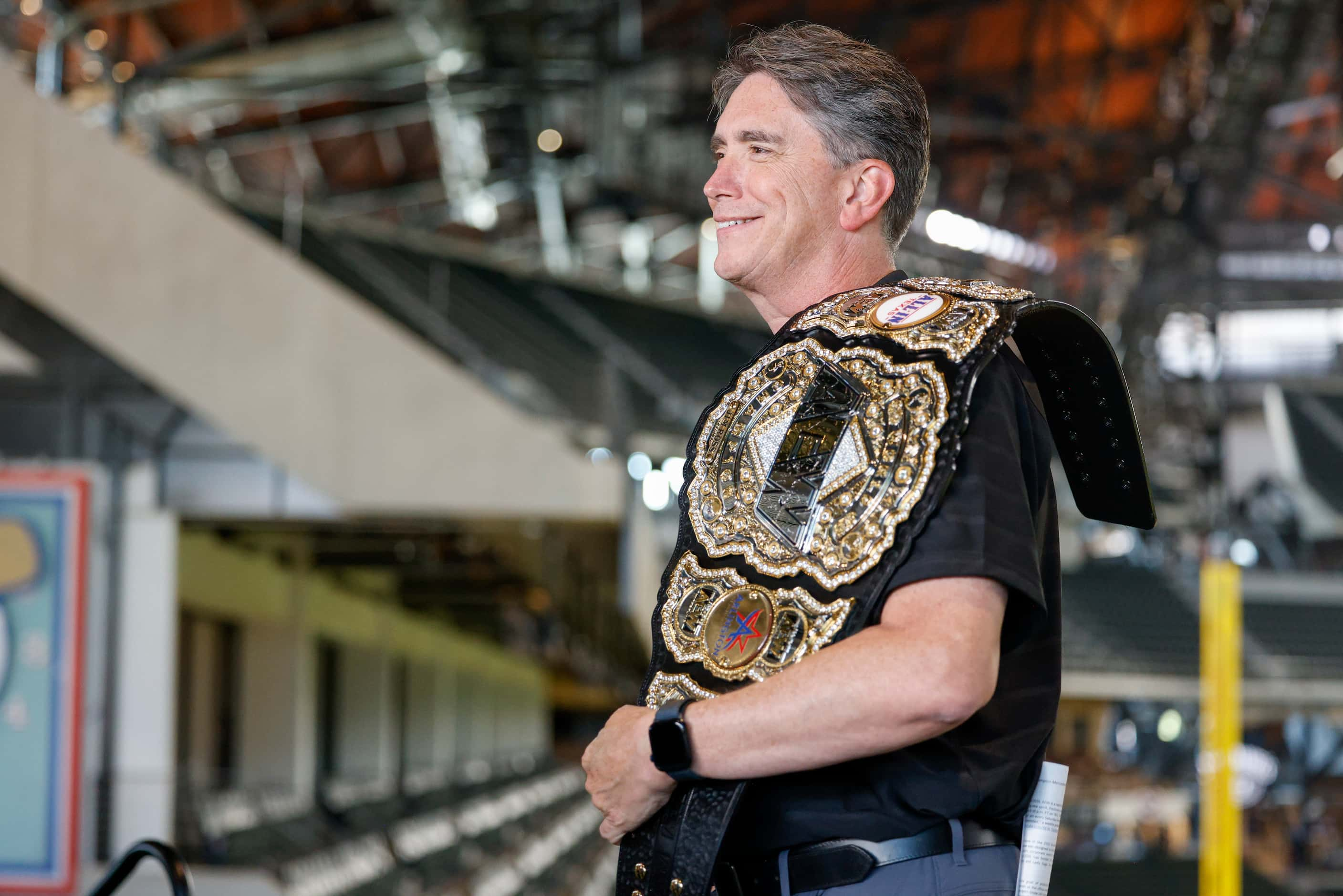 Arlington city manager Trey Yelverton poses with an AEW championship belt at Globe Life...