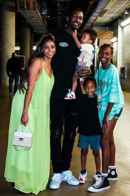 Mavericks forward Dorian Finney-Smith poses with JazMyne Branch and their sons, Aysen and...