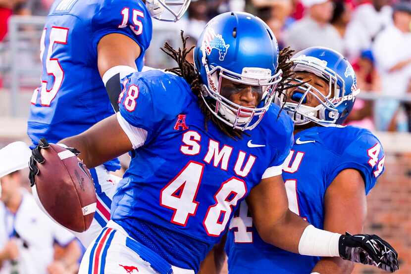 SMU linebacker Anthony Rhone celebrates after a defensive play during an NCAA football game...