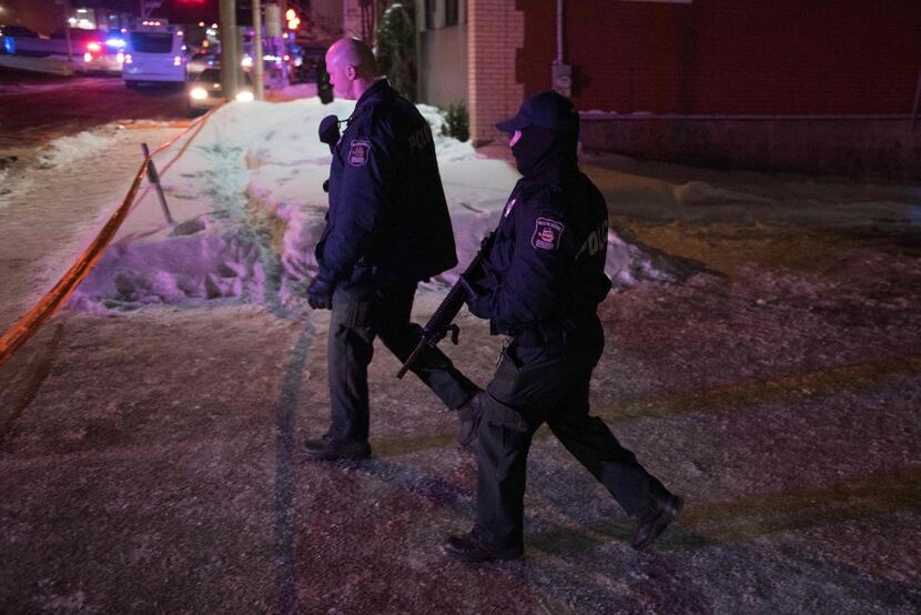 Canadian police officers patrolled after a shooting at a mosque in Quebec City. (Agence...