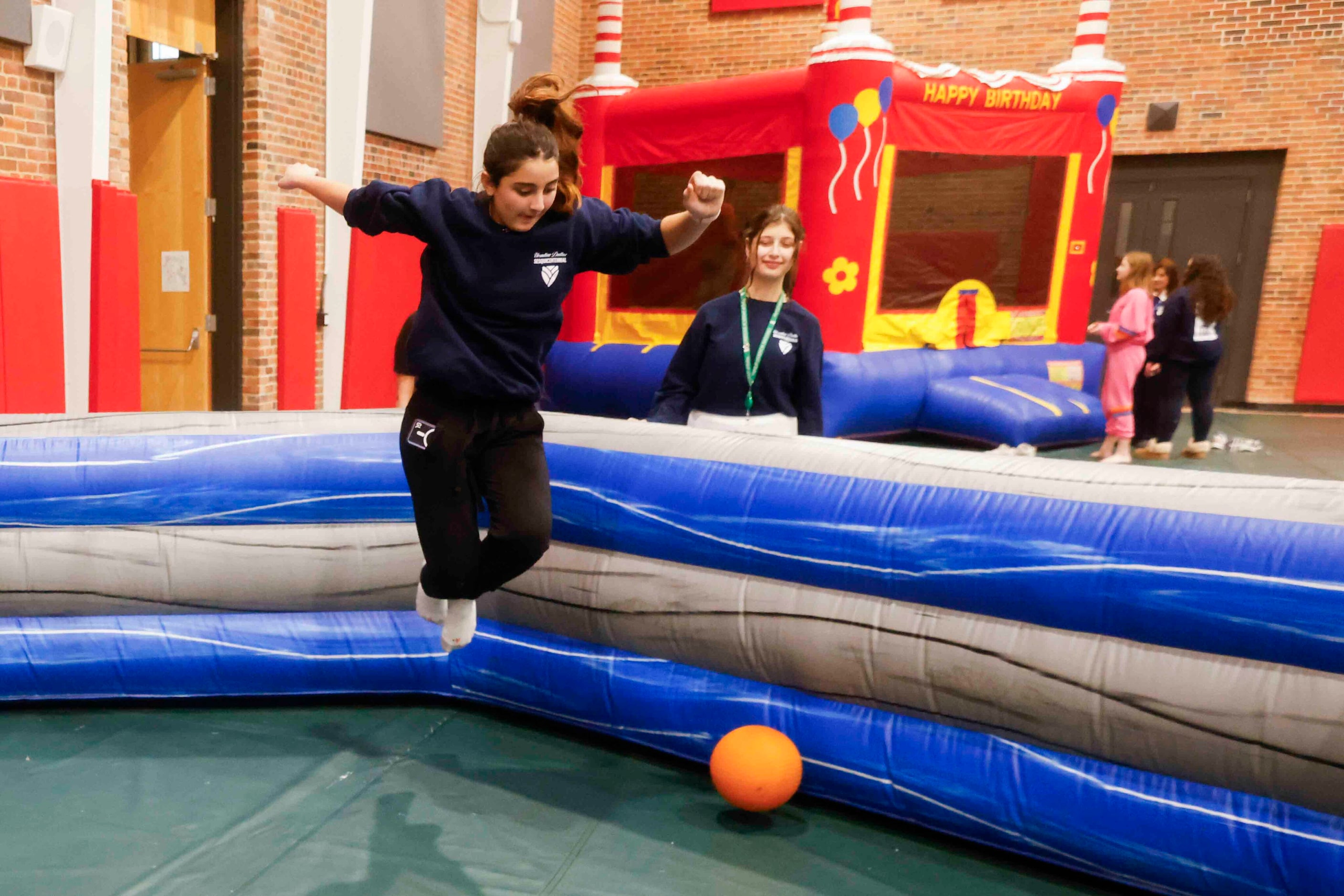 Student Myriam Monroe jumps while playing Gaga Ball during the 150th anniversary celebration...