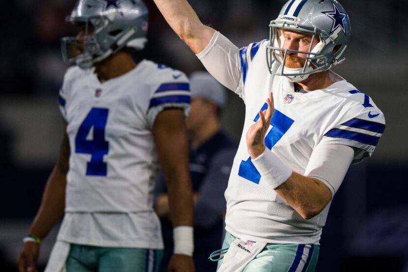 Dallas Cowboys quarterback Cooper Rush (7) throws a pass during warmups before an NFL...