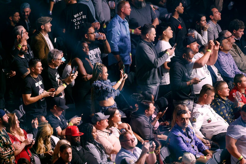 Boxing fans watch as Katie Taylor makes her way to the ring before her undisputed super...