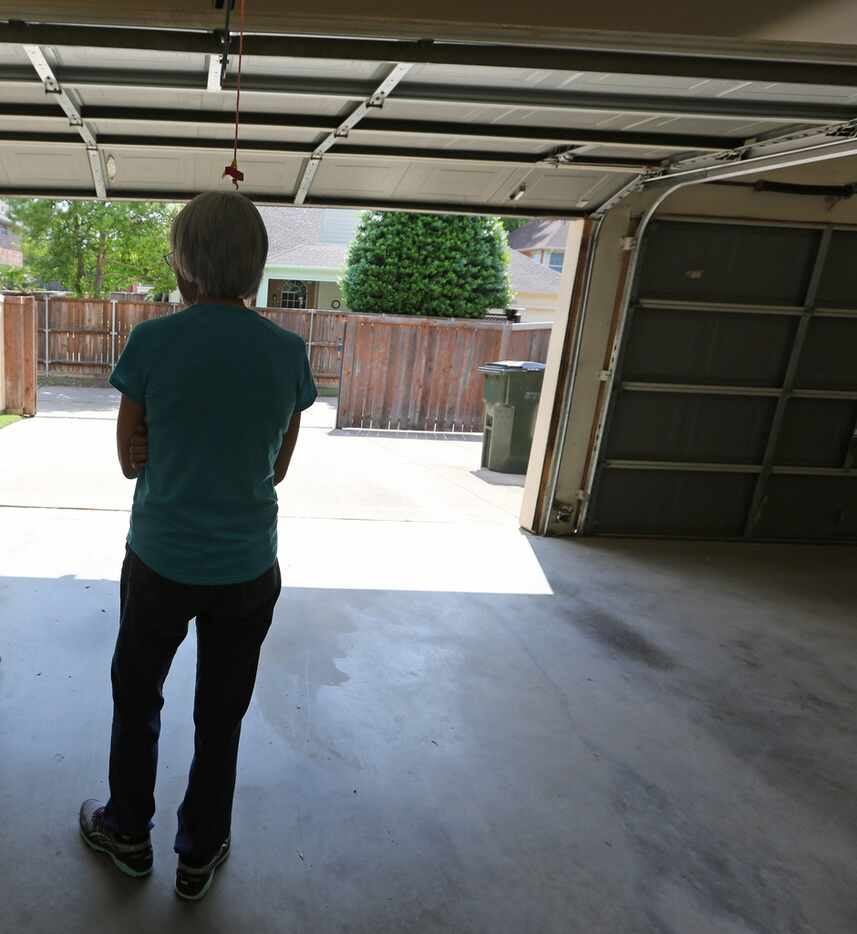 Cindy Collinvitti, widow of Christopher Collinvitti, stands in the garage near the spot...