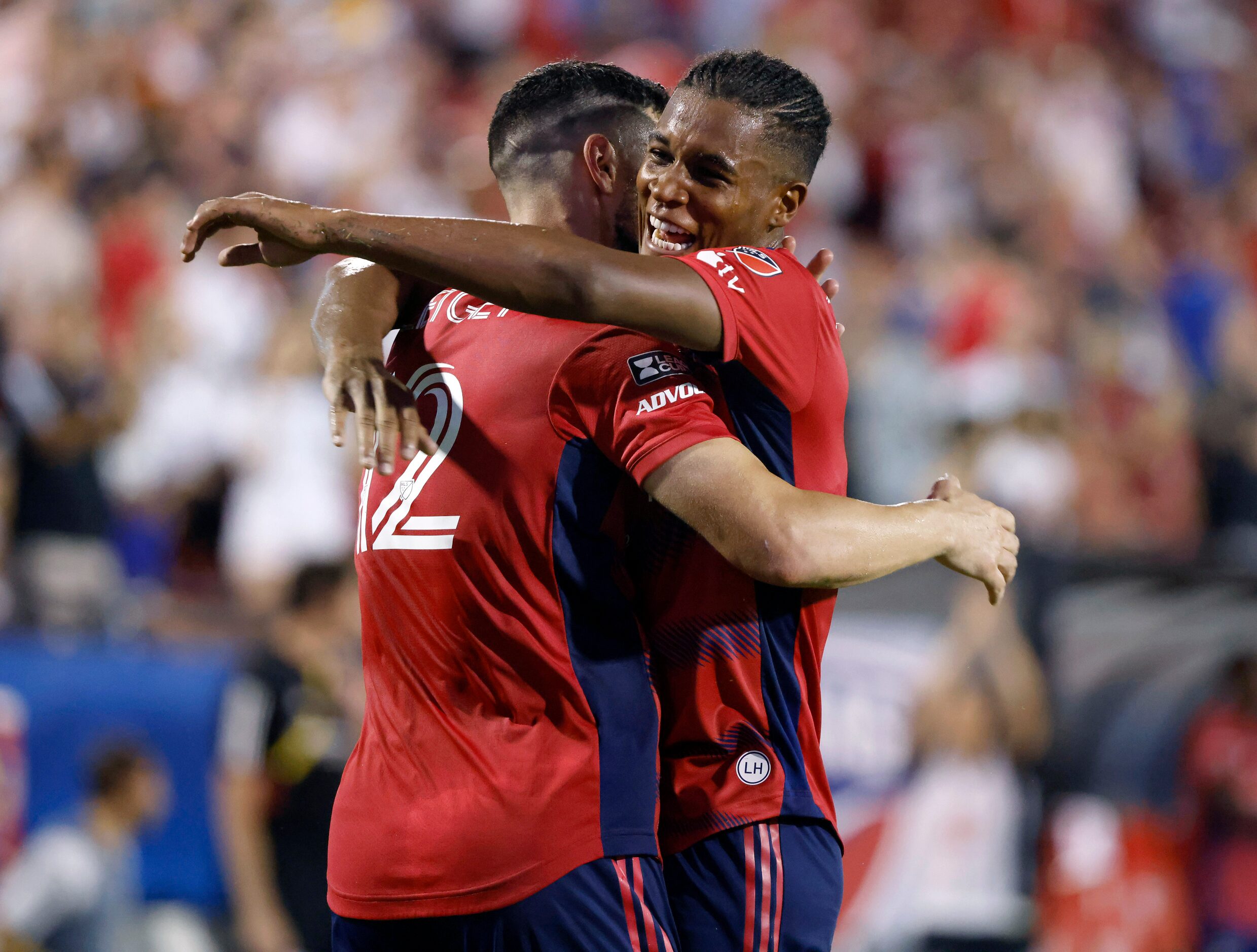 FC Dallas defender Geovane Jesus (2) congratulates Sebastian Lletget (12) following his...