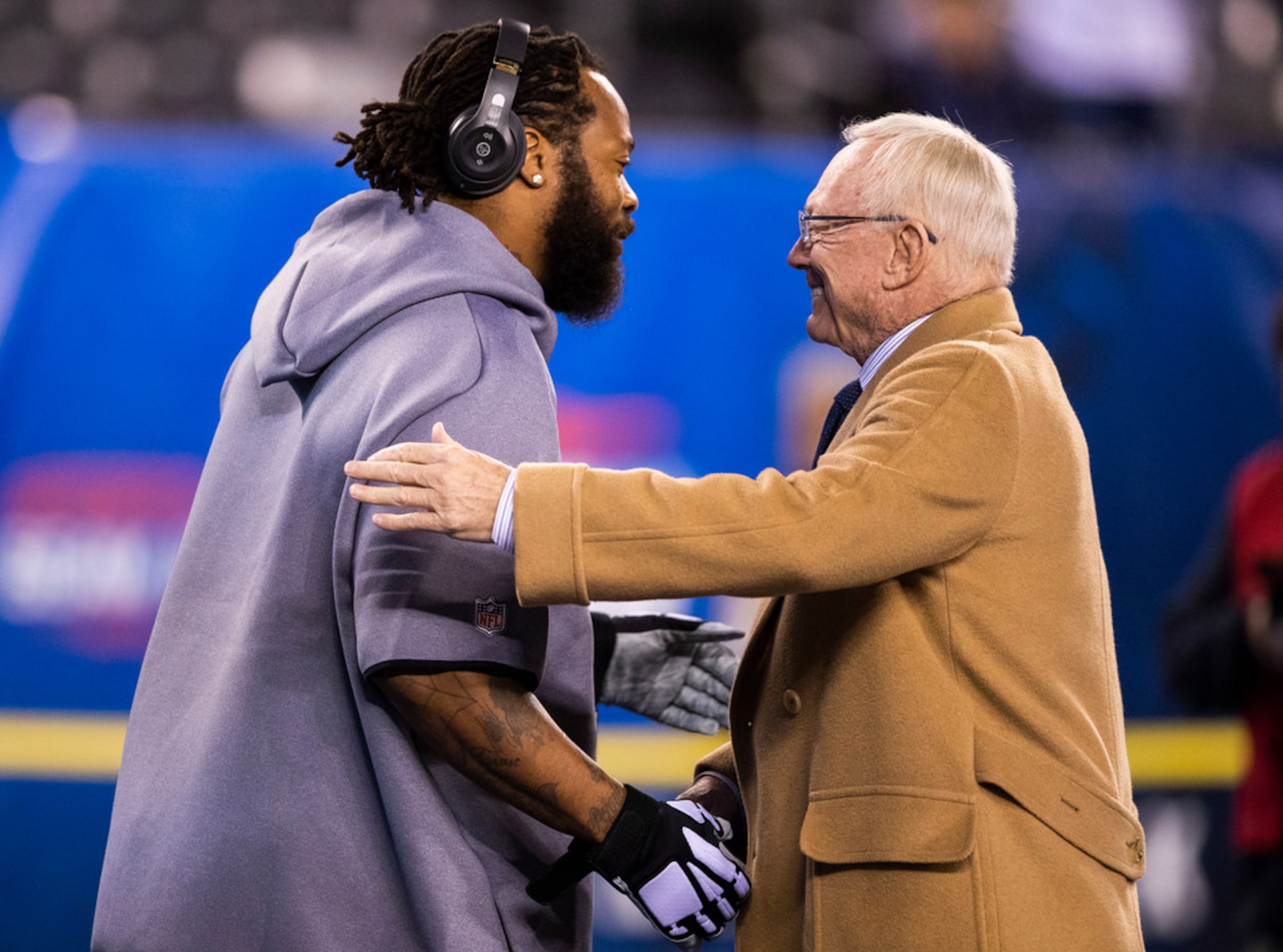 Dallas Cowboys Owner Jerry Jones talks with Dallas Cowboys defensive end Michael Bennett...