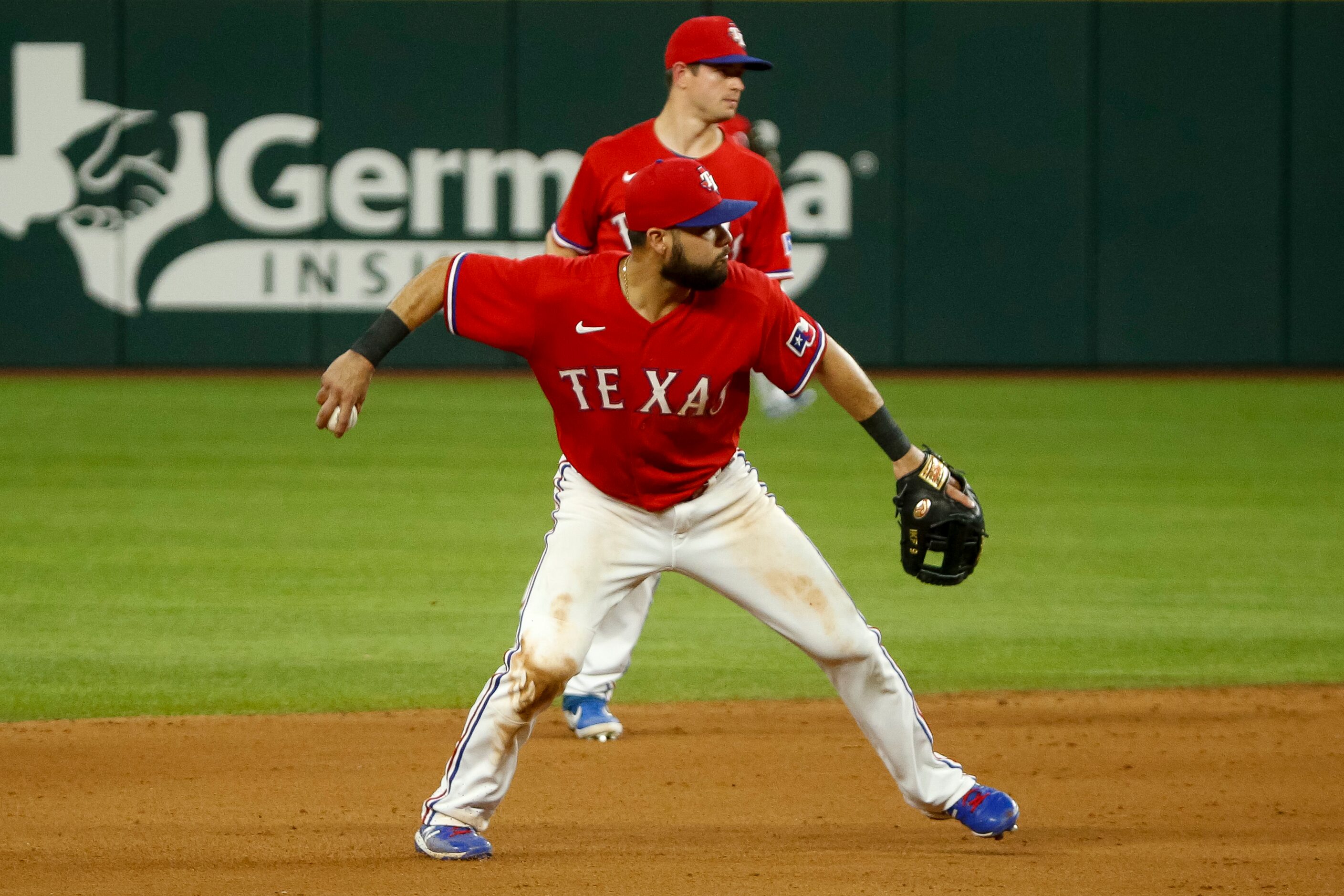 Texas Rangers shortstop Isiah Kiner-Falefa (9) throws to first for an out during the ninth...