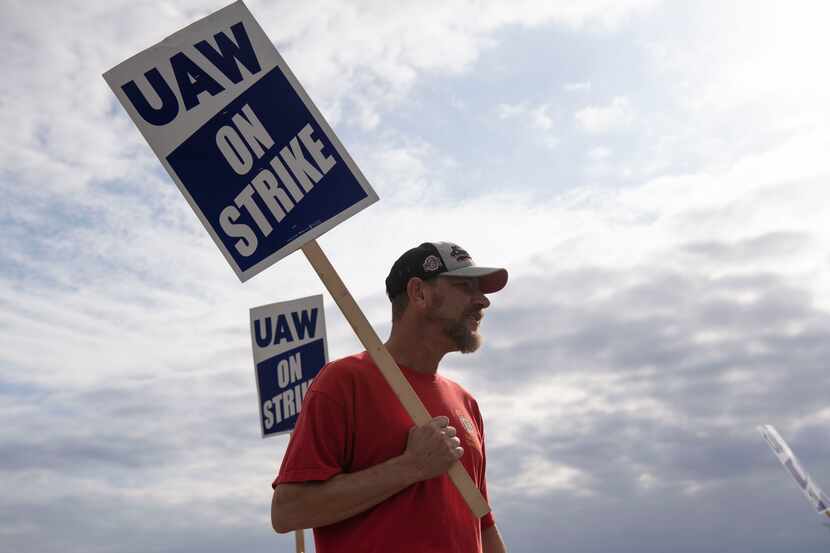 David Barger stands with other workers near the General Motors plant in Spring Hill, Tenn.,...