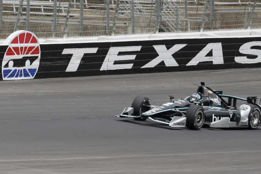 Josef Newgarden (2) drives through a turn during IndyCar auto race track testing at Texas...