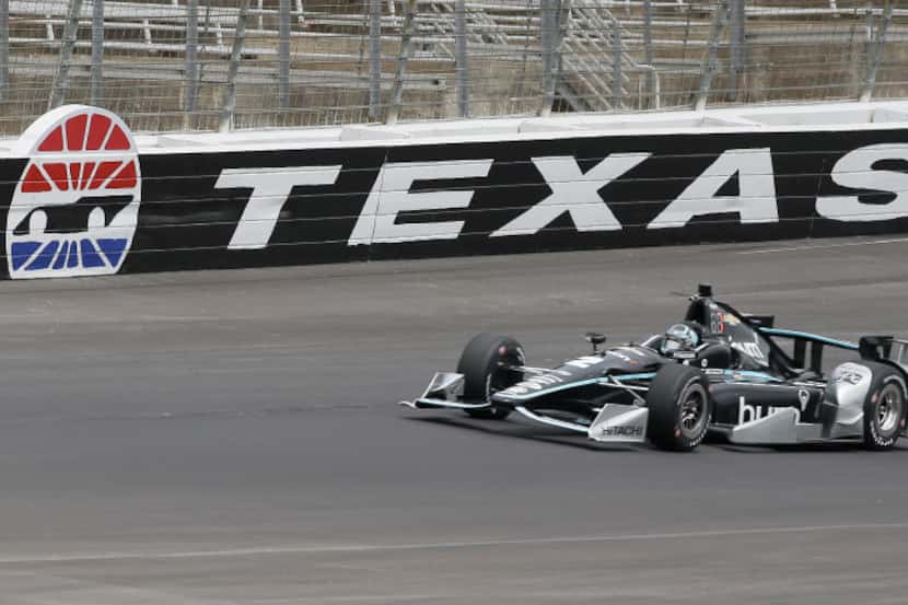 Josef Newgarden (2) drives through a turn during IndyCar auto race track testing at Texas...