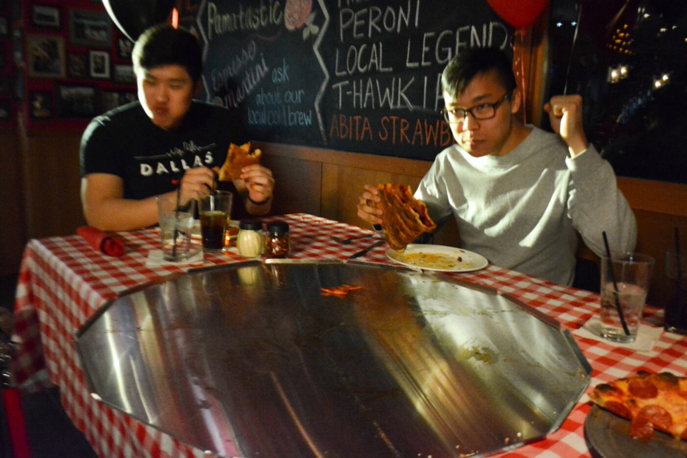 Justin Tak, left and his friend Jacob Rha, came close to finishing the 32-inch pizza in 45...