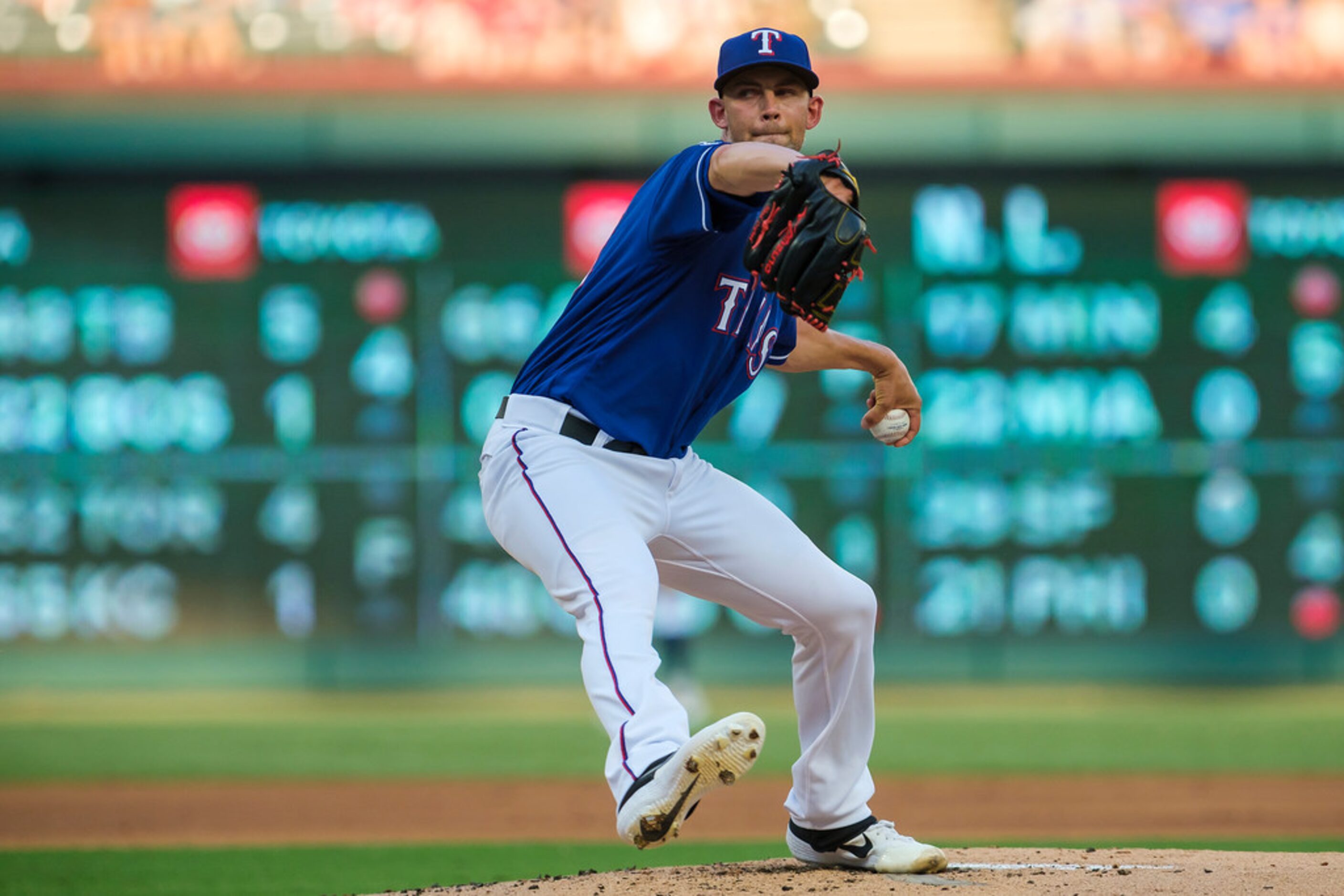 Texas Rangers starting pitcher Mike Minor delivers during the first inning against the...