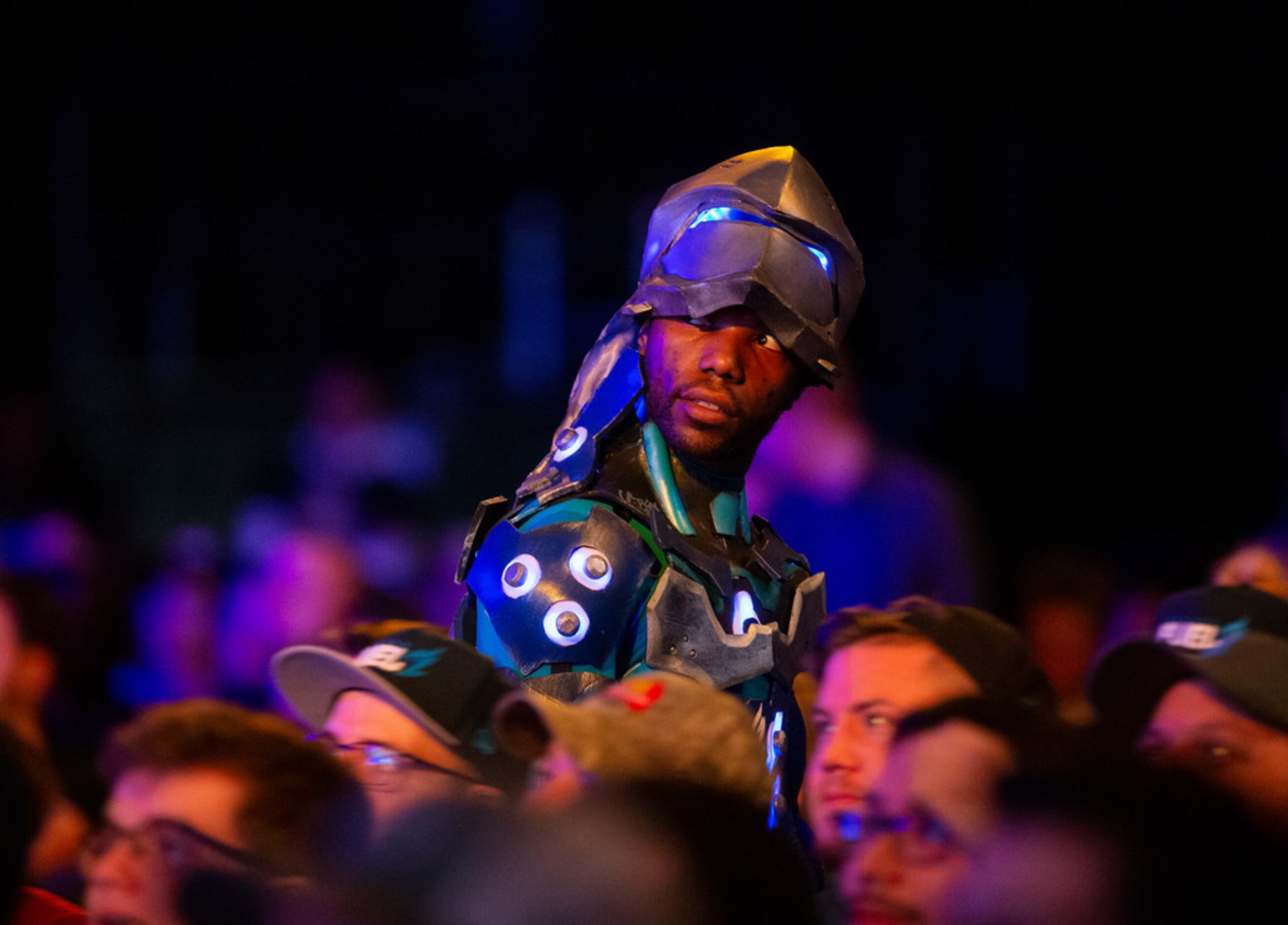 A cosplayer watches the Dallas Fuel during the season three opening weekend  match of the...