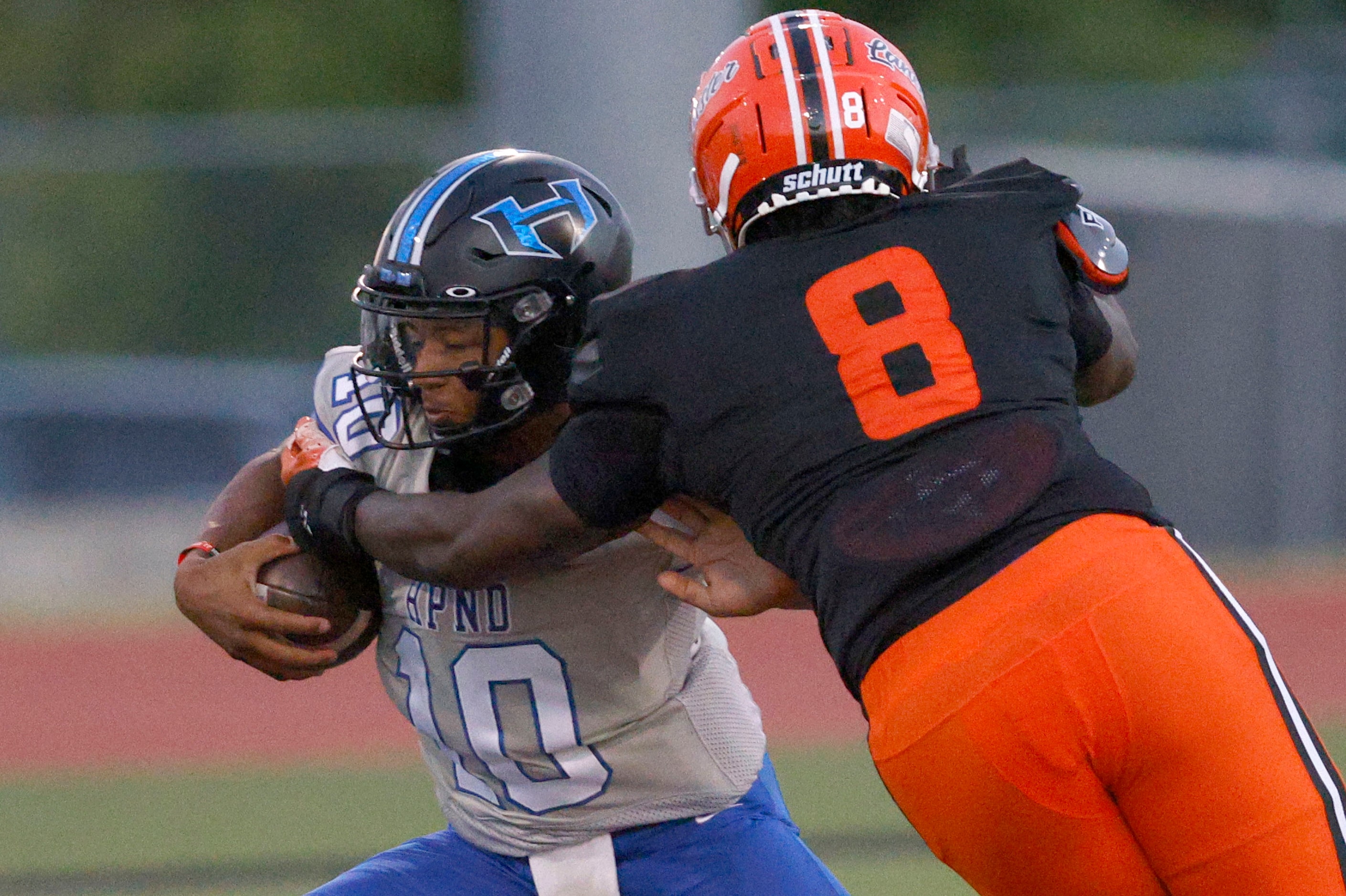 Hebron’s quarterback Patrick Crayton Jr. (10) is tackled by Lancaster’s Jaydan Shaw (8) in...