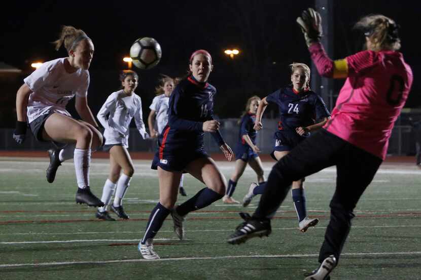 Southlake Carroll forward Madison Drenowatz (14) fires a shot on goal, which was thwarted by...