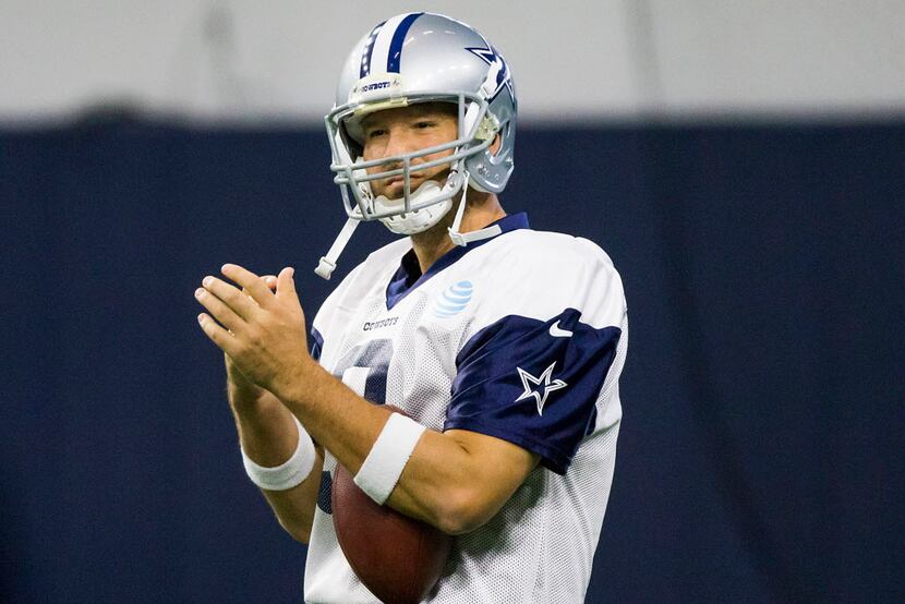 Dallas Cowboys quarterback Tony Romo takes the field for the team's practice at The Star on...