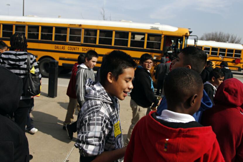 Dallas ISD fifth-grade boys headed back to their school buses after a screening of "Red...