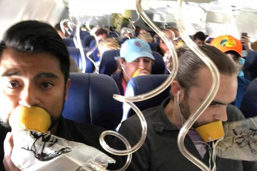 Passenger Marty Martinez (left) took this selfie after a jet engine blew out on the...