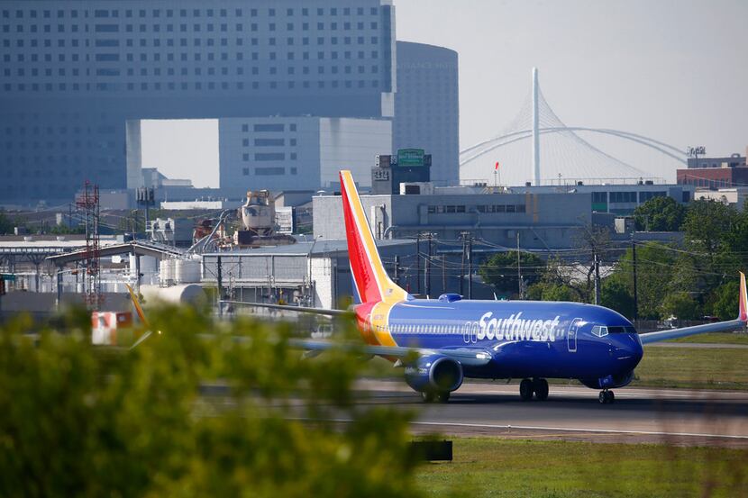A Southwest Airlines takes off at Dallas Love Field Airport on April 23, 2018. Seen in the...