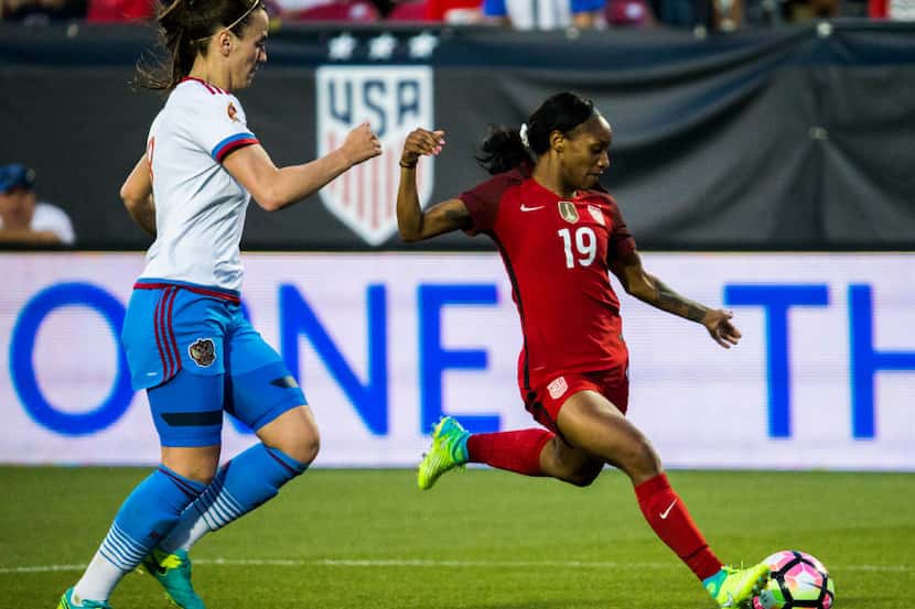 U.S. forward Crystal Dunn (19) takes a shot at goal during the first half of a friendly...