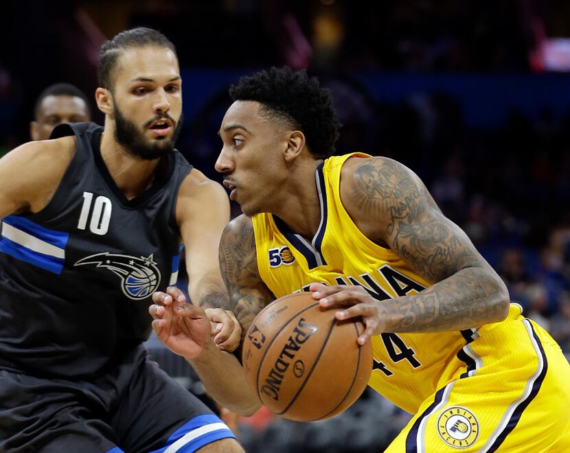 Indiana Pacers' Jeff Teague, right, drives around Orlando Magic's Evan Fournier (10) during...
