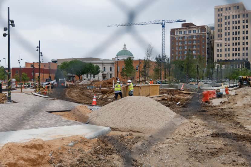 Workers continue the construction of Harwood Park, the final of the four priority parks in...