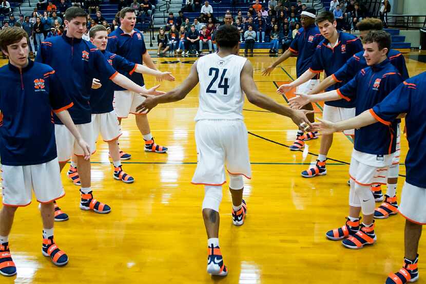 McKinney North post Shannon Watkins (24) takes the floor before a high school basketball...