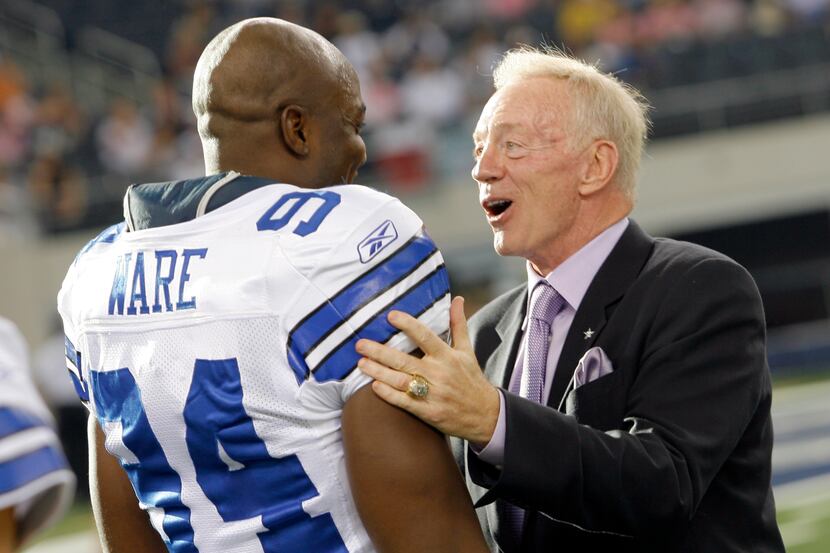 Dallas Cowboys team owner Jerry Jones talks with linebacker DeMarcus Ware (94) prior to the...