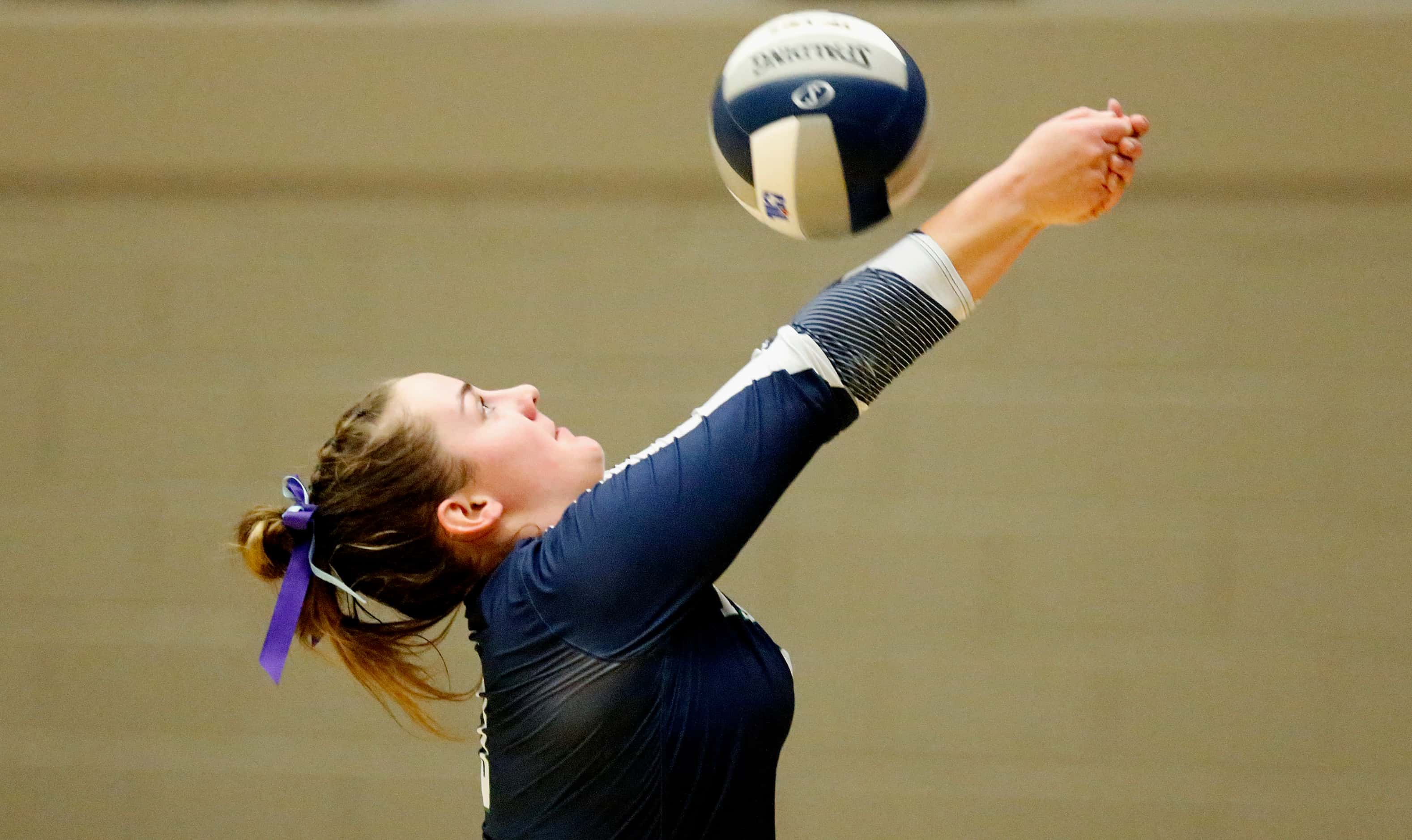 V.R. Eaton High School outside hitter Paige Mooney (3) keeps the ball in play during game...