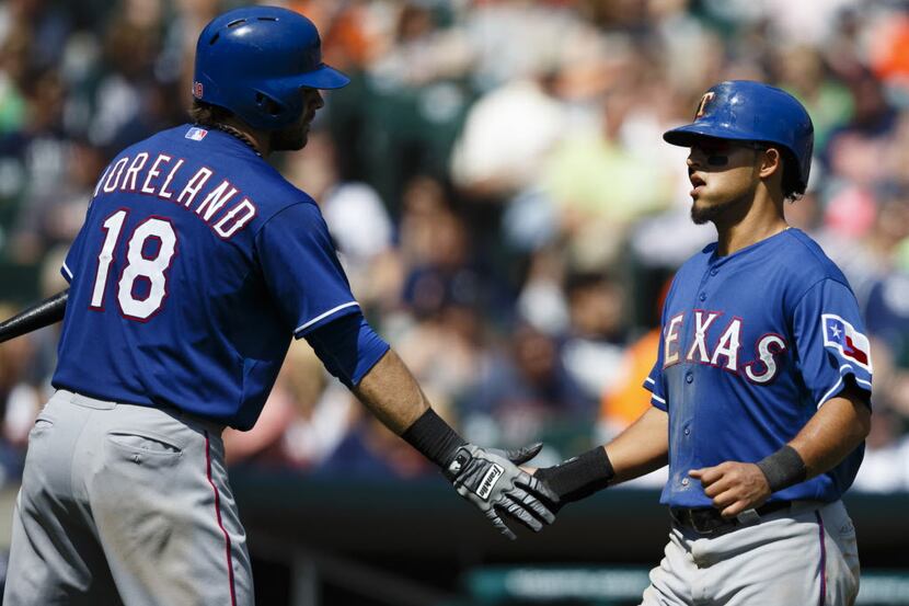 May 25, 2014; Detroit, MI, USA; Texas Rangers second baseman Rougned Odor (right) receives...