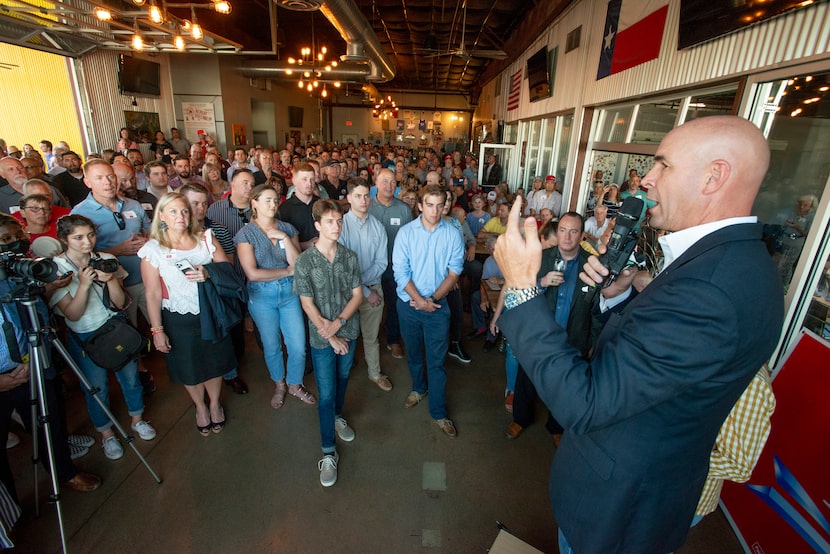 Congressional District 6 candidate Jake Ellzey speaks to supporters during an evening...