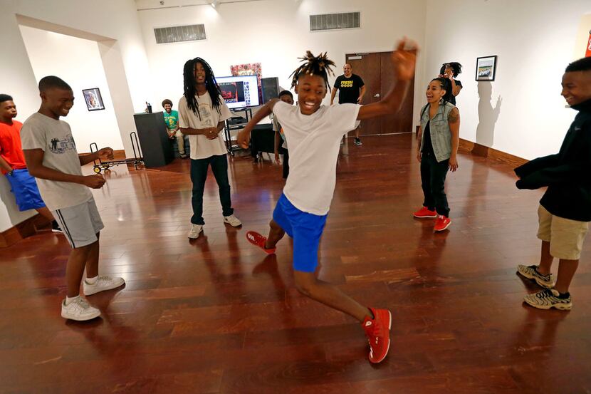 Rykeiz Smith, 14, center, shows some of his dance moves during a hip-hop summer class at...