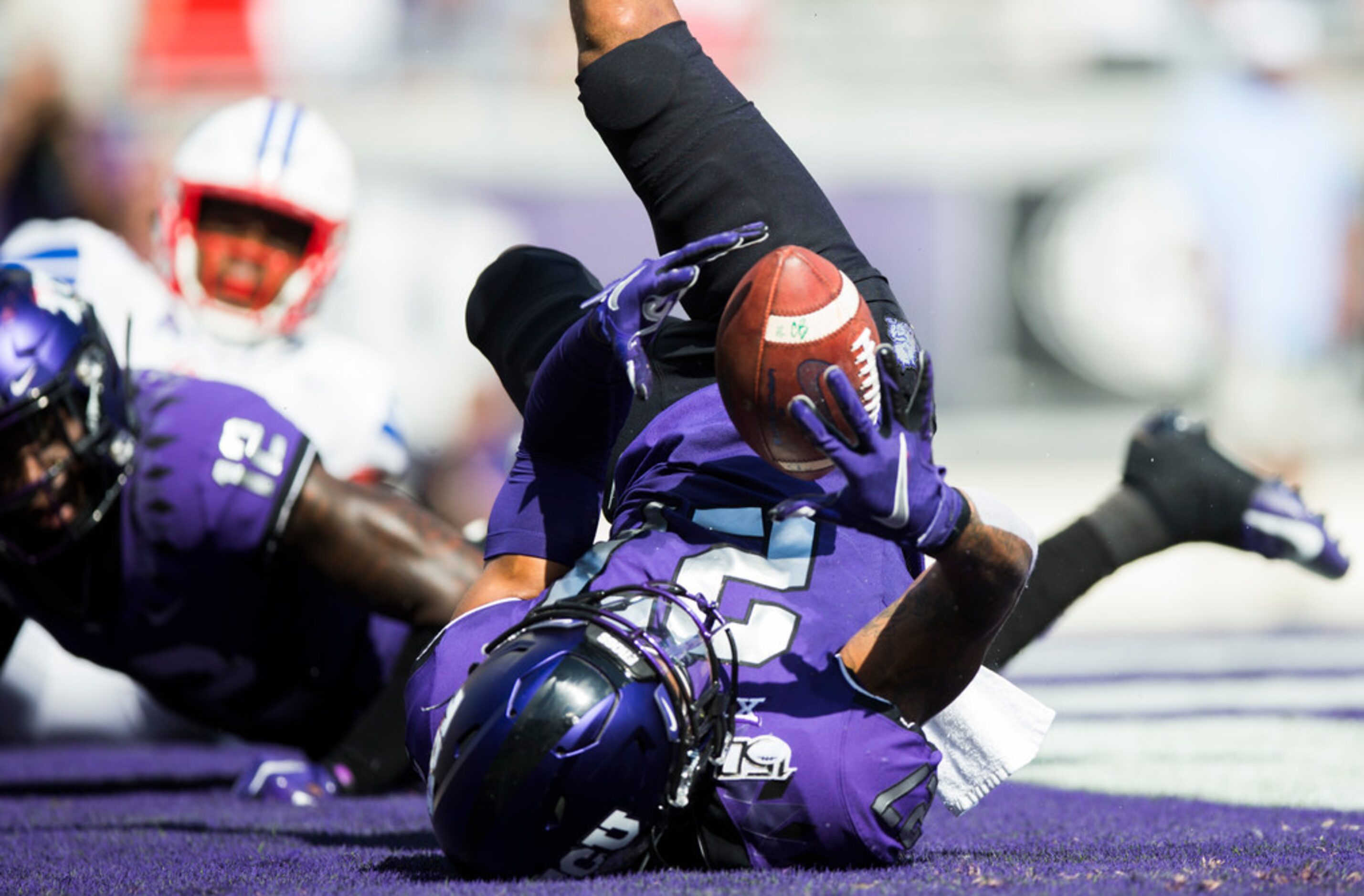 TCU Horned Frogs safety Ar'Darius Washington (27) hangs on to an interception in the end...