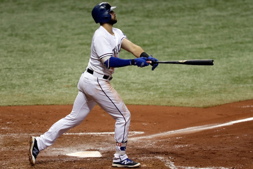 Texas Rangers' Joey Gallo watches his two-run home run off Houston Astros starting pitcher...