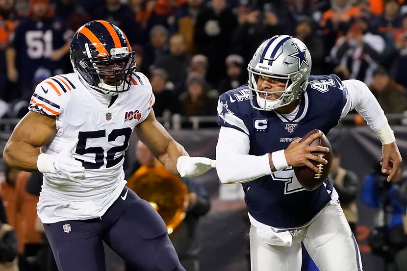 Dallas Cowboys quarterback Dak Prescott (4) is flushed from the pocket by Chicago Bears...