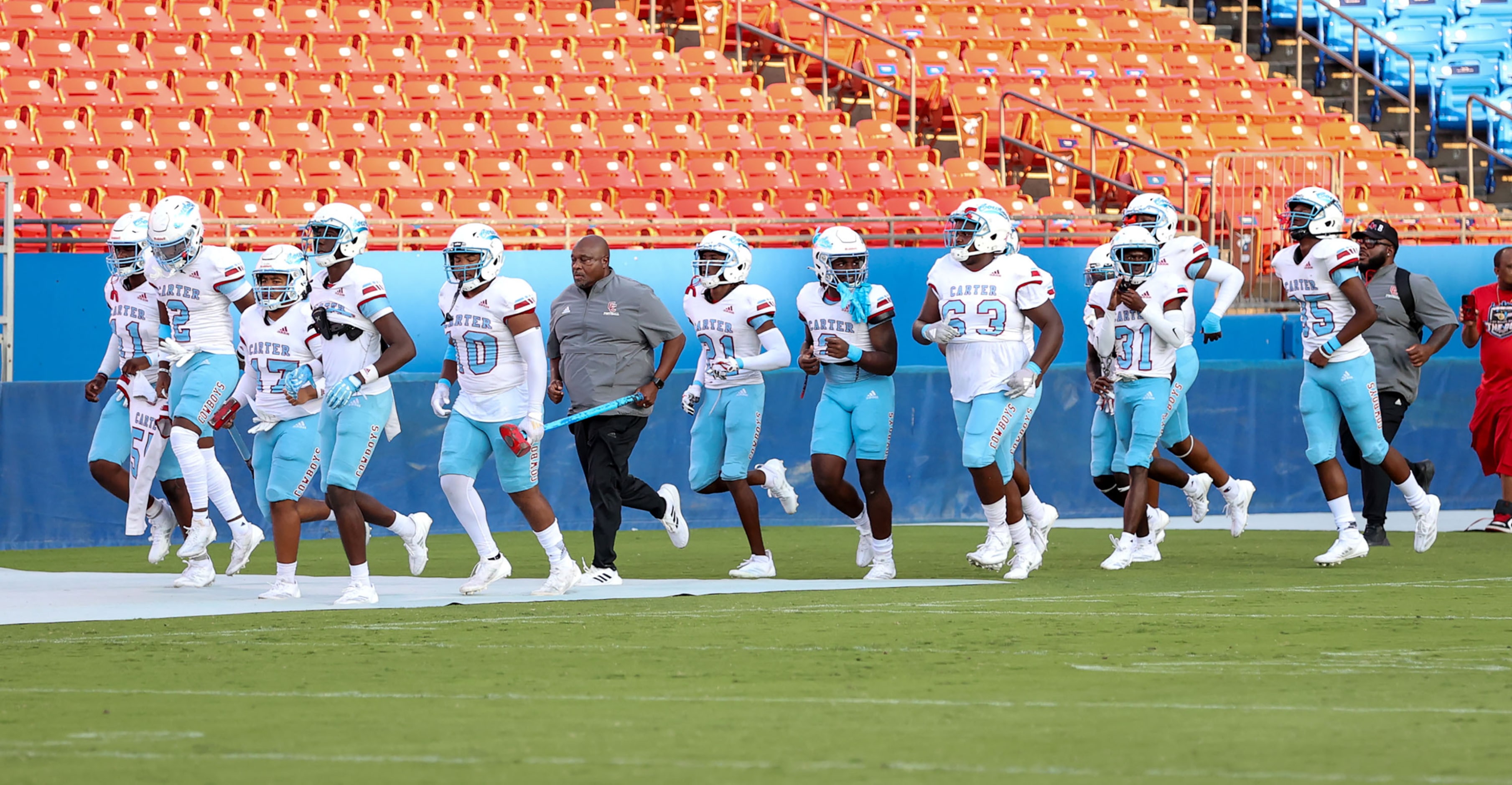 The Dallas Carter Cowboys enter the field to face Frisco Panther Creek in a high school...