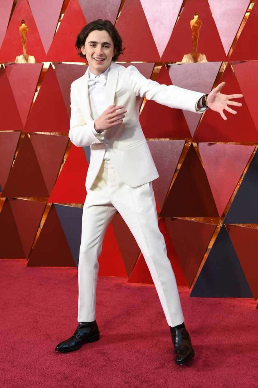 Actor Timothee Chalamet stuns in white at the Academy Awards 2018.