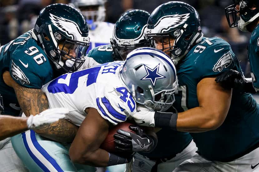 Dallas Cowboys running back Rod Smith (45) is wrapped up by Philadelphia Eagles defensive...