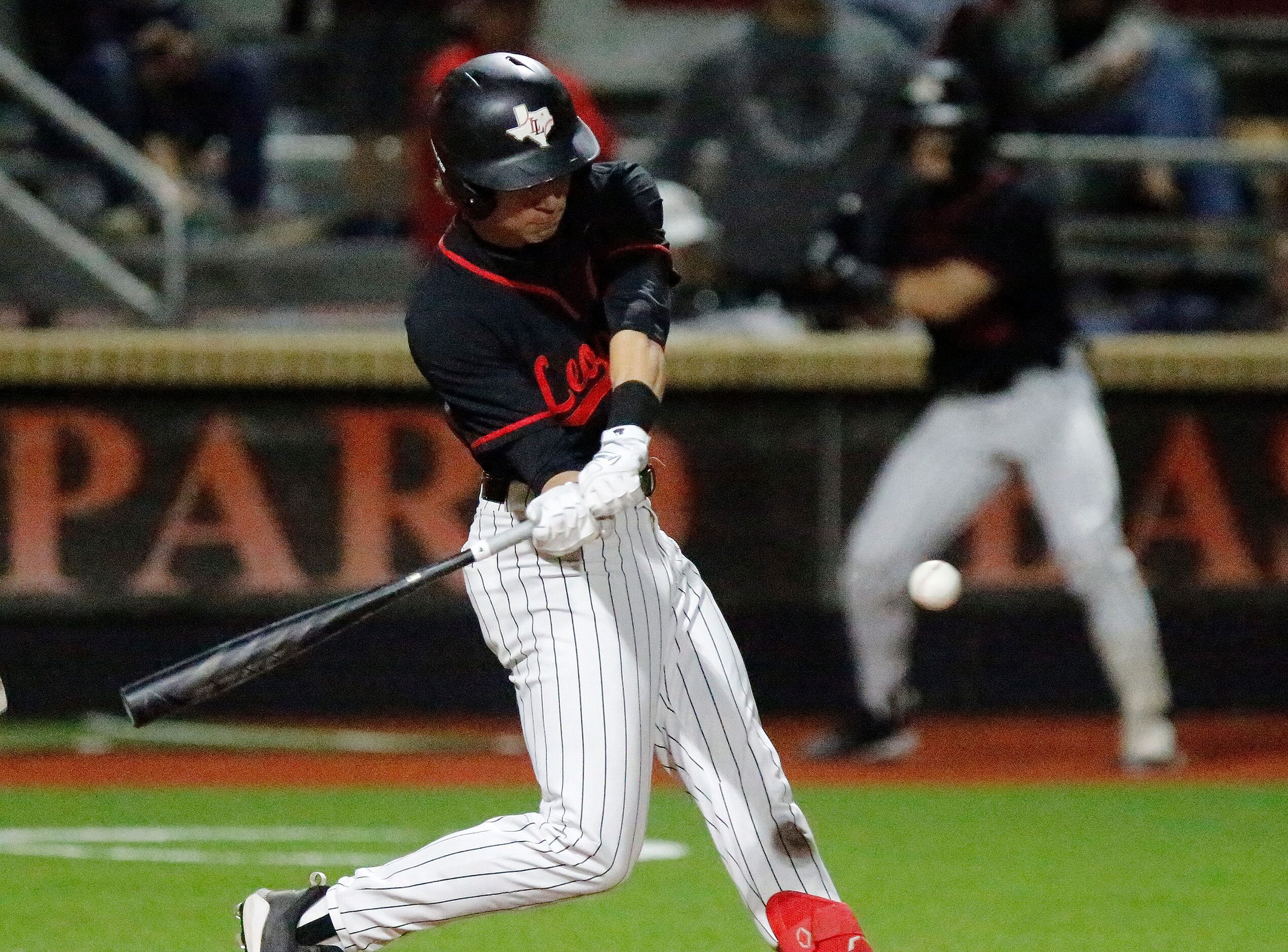 Lovejoy High School Aidan Smith (13) makes contact in the third inning as Lovejoy High...