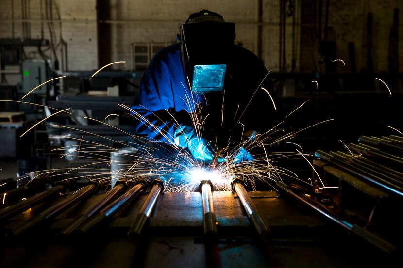 In this July 16, 2014 photo, a welder fabricates anchor bolts for roads and bridges at the...