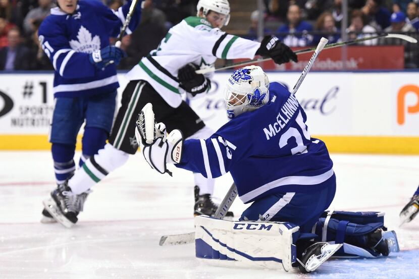 Toronto Maple Leafs goalie Curtis McElhinney (35) makes a save against the Dallas Stars...