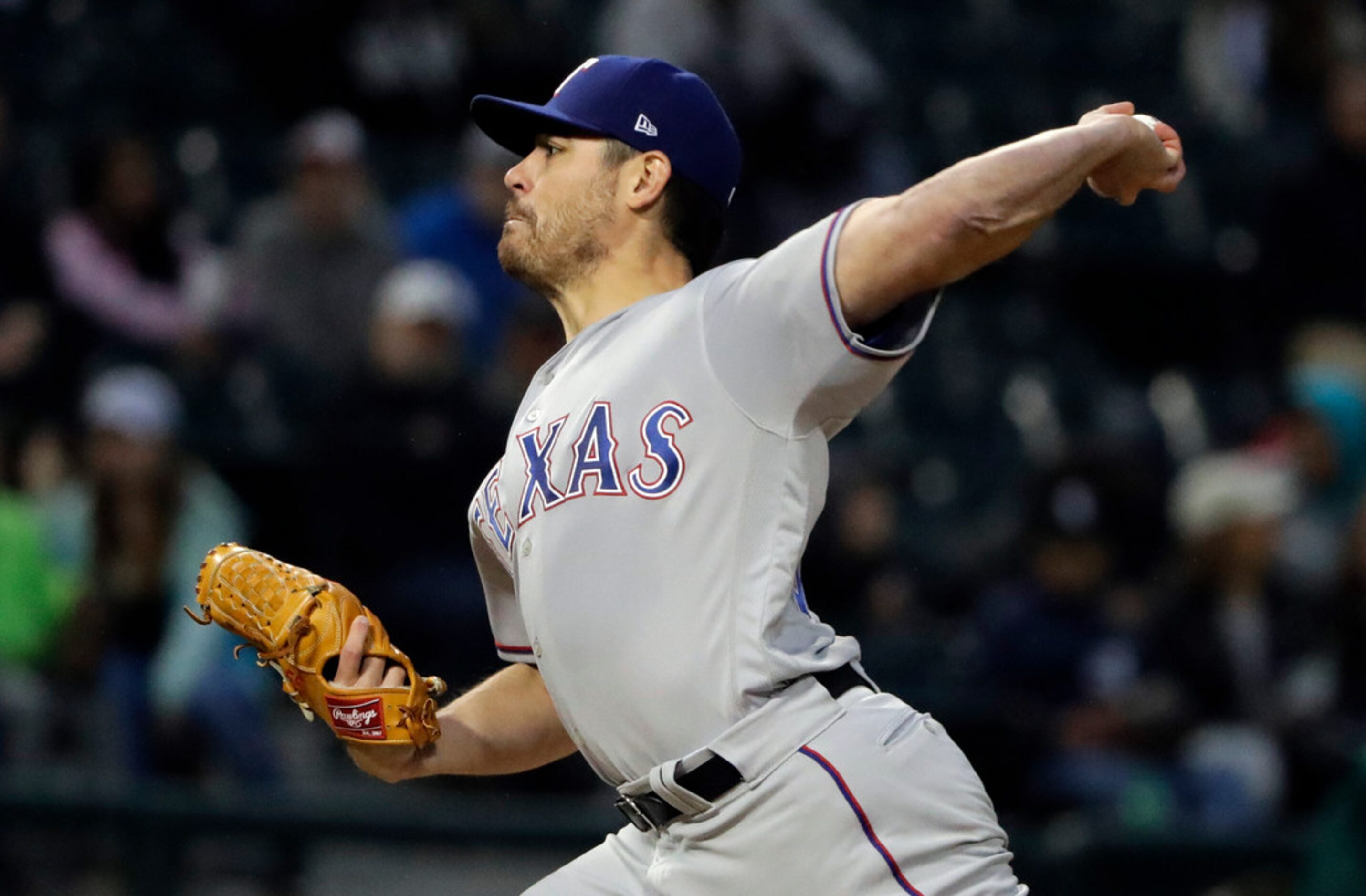 Texas Rangers starting pitcher Matt Moore throws to a Chicago White Sox batter during the...