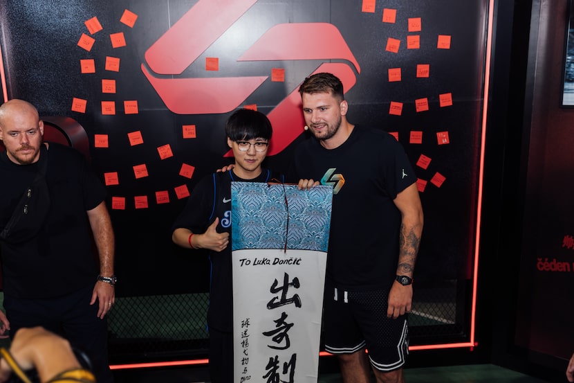 Luka Doncic poses with a fan at the Nike Shanghai campus during the Jordan Brand Family Tour.