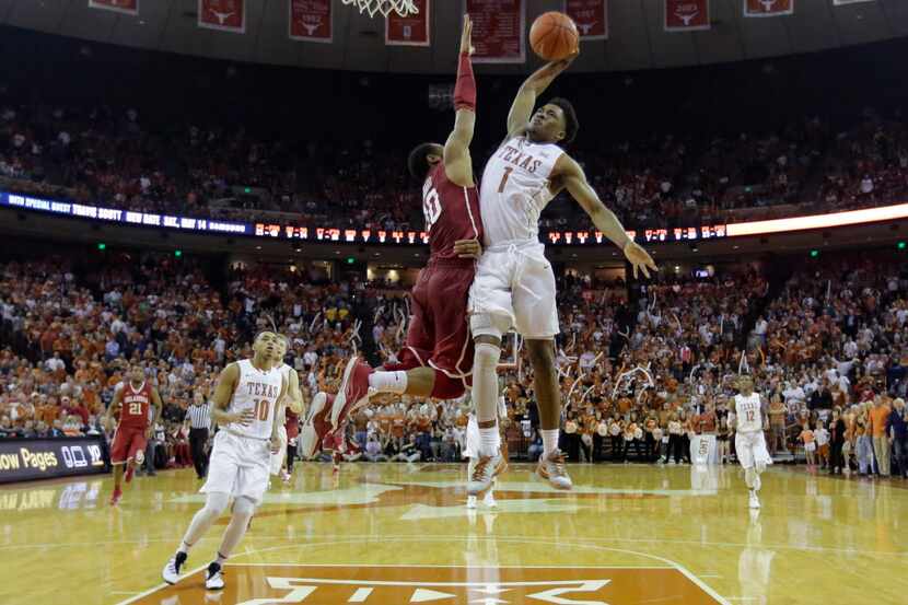 Texas guard Isaiah Taylor (1) drives to the basket against Oklahoma guard Jordan Woodard...
