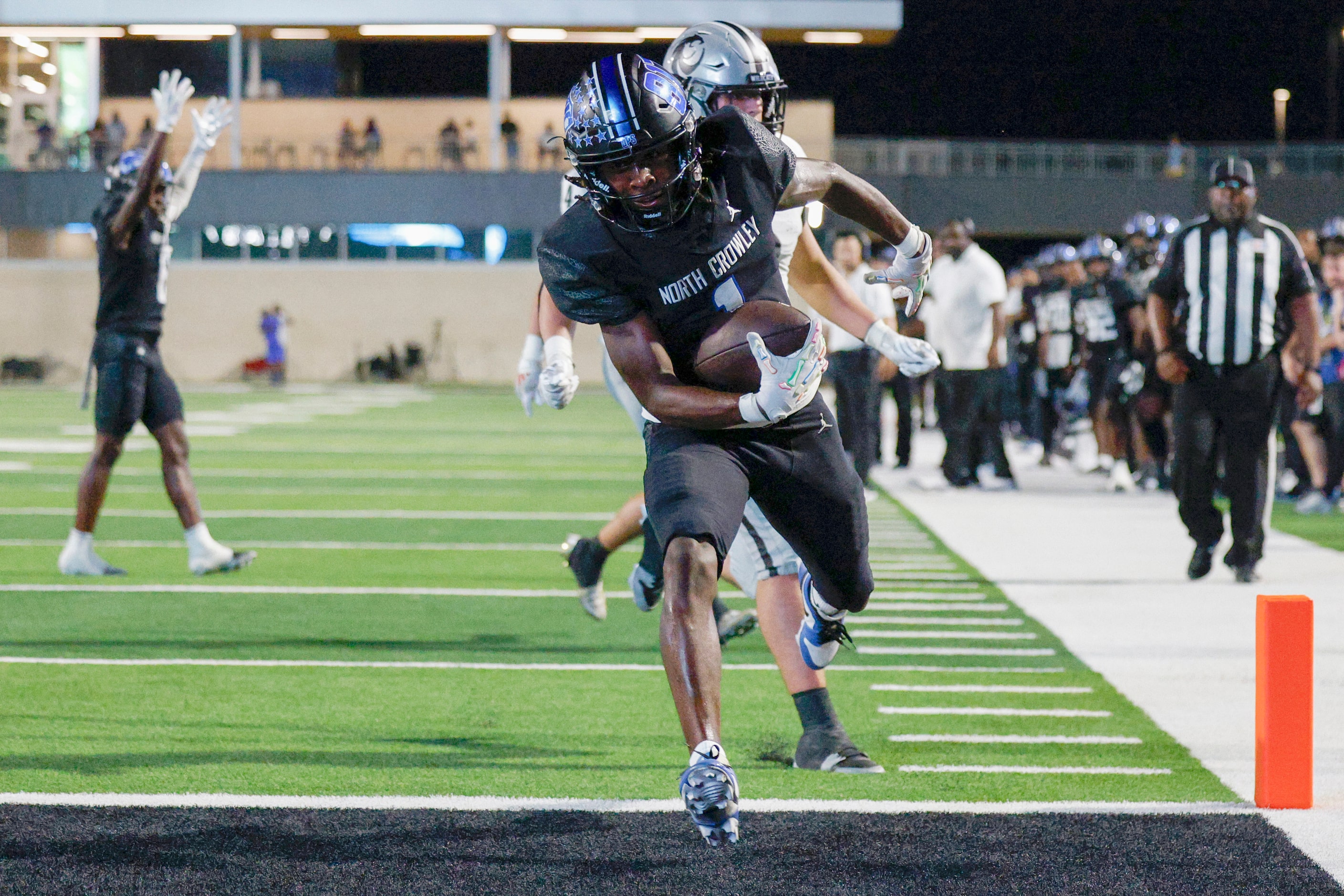 North Crowley linebacker Cornelius Warren (1) scores a touchdown ahead of a Denton Guyer...