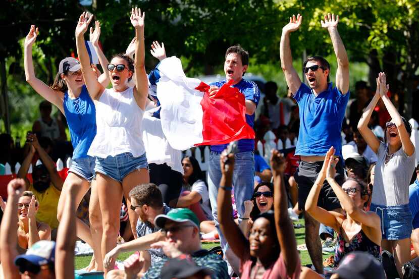 French soccer fans celebrate a first half goal during a World Cup watch party at Klyde...